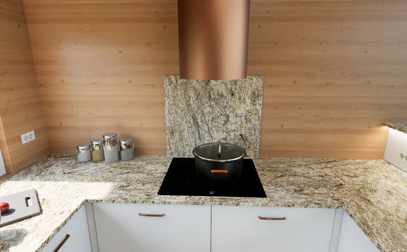 The hob, centred over the drawers, with a stone splashback only behind it