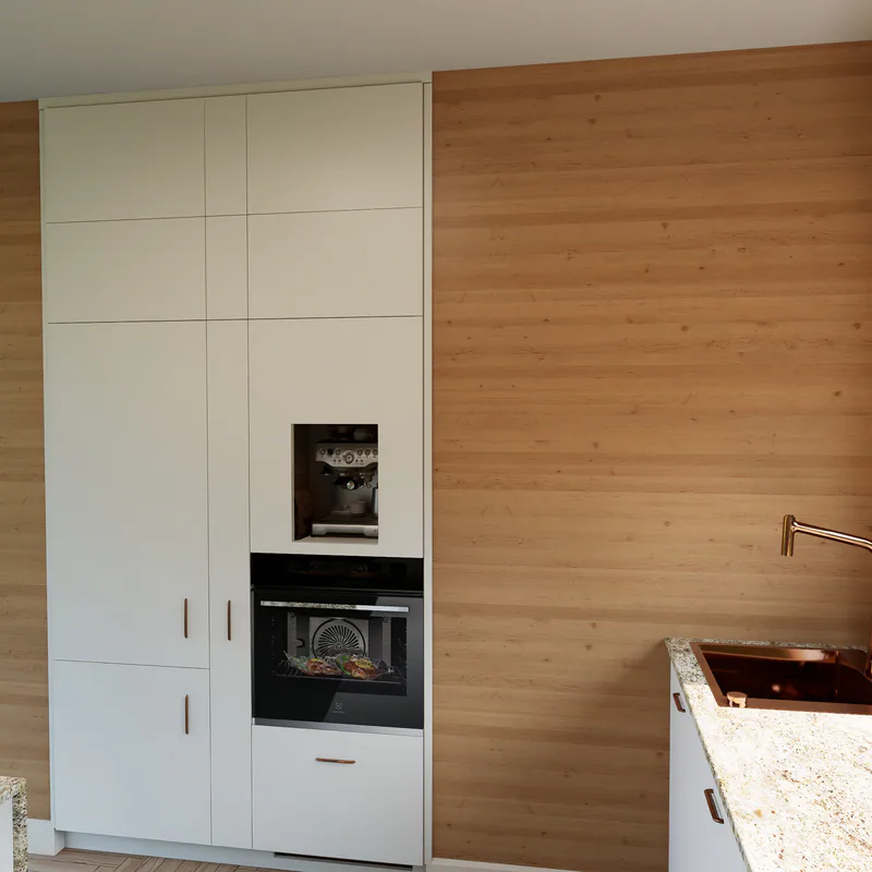 The tall column: fridge, a narrow pull-out, the oven, and the coffee machine behind a framed opening