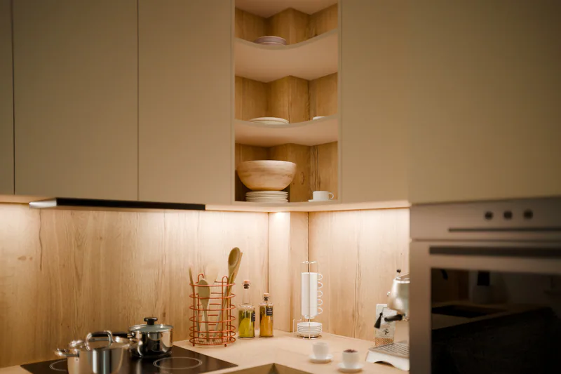 The rounded corner shelf, with oak backs and LED strips under each shelf