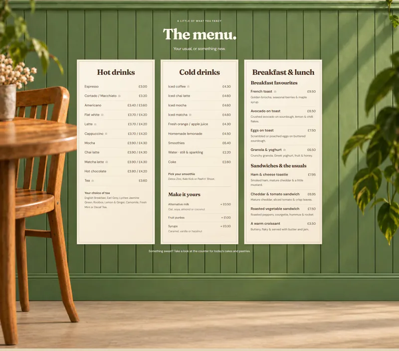 The menu as three cream boards on the sage panelling